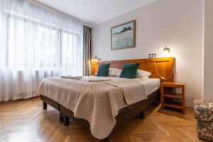 Posteľ alebo postele v izbe v ubytovaní WILLA ORNAK