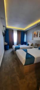 Letto o letti in una camera di Mar Charbel Hotel Cairo