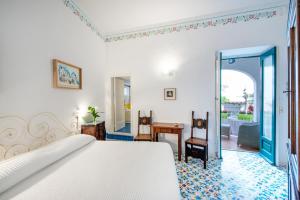 Postel nebo postele na pokoji v ubytování Amalfi un po’...