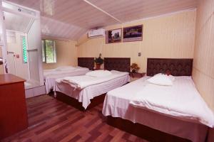 Postel nebo postele na pokoji v ubytování 武当山仙山旅馆景区内店