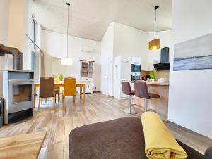 a living room and dining room with a table and chairs at Seeschwalbe 329 in Mirow