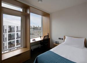 เตียงในห้องที่ Trinity College - Campus Accommodation