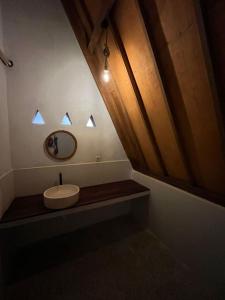 a bathroom with a sink and a mirror at Jepun homestay in Bumbang