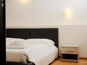 Postel nebo postele na pokoji v ubytování Hotel Arezzo ASC