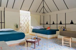 Postel nebo postele na pokoji v ubytování Le Relais De Marrakech
