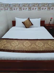 Postel nebo postele na pokoji v ubytování Sơn Tùng Motel