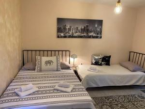 Postel nebo postele na pokoji v ubytování Apartmani Padrov