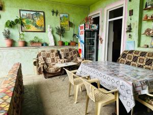 a living room with a table and a couch at Lovely Goris in Goris