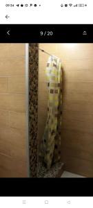 a bathroom with a stack of toilet paper on a wall at Odessa Mama in Bijela