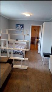 a room with two bunk beds and a couch at Odessa Mama in Bijela