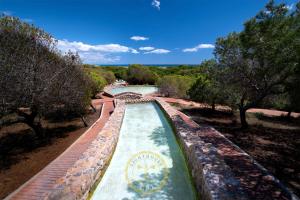 a water feature in a park with a river at Lighthouse Dunamar in La Mata