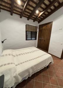 Postel nebo postele na pokoji v ubytování Villa Los abuelos