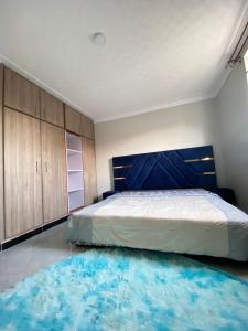 Ένα ή περισσότερα κρεβάτια σε δωμάτιο στο Thee haven Boulevard