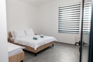 Postel nebo postele na pokoji v ubytování Prenoćište CMA