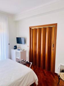 TV a/nebo společenská místnost v ubytování Montesanto 25 + 29 fotografií