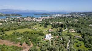 an aerial view of a house on a hill with a lake at Kassiani-Sofia Cottage in Gouvia