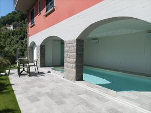 a house with a swimming pool next to a building at Da Arturo e Maruca in Vellano