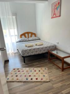 Postel nebo postele na pokoji v ubytování Torrenostra Apartment