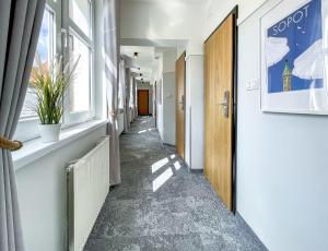 a corridor of an office building with a hallway at SeaSide Sopot - butikowe noclegi przy plaży in Sopot