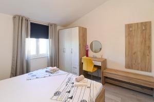 Łóżko lub łóżka w pokoju w obiekcie Vacation house Ulika