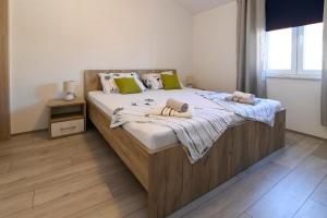 Łóżko lub łóżka w pokoju w obiekcie Vacation house Ulika
