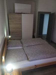 two beds in a bedroom with a light on it at Apartment in Bad Ems in Bad Ems