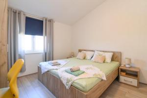 Łóżko lub łóżka w pokoju w obiekcie Vacation house Ulika