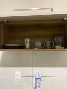 a cupboard with a bunch of utensils on it at Apt na Lapa - RJ in Rio de Janeiro