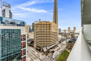 a view of a city with a tall skyscraper at Estate 1 Bedroom Condo Front Street West in Toronto