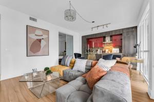 a living room with a couch and a table at Estate 1 Bedroom Condo Front Street West in Toronto
