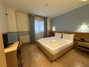 Postel nebo postele na pokoji v ubytování Active Hotel Gran Zebru'
