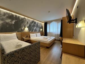 Postel nebo postele na pokoji v ubytování Active Hotel Gran Zebru'