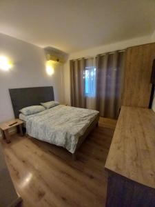 Postel nebo postele na pokoji v ubytování VILA SAMI