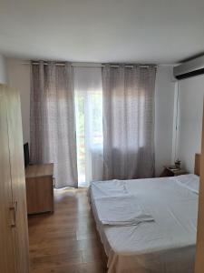 Postel nebo postele na pokoji v ubytování VILA SAMI