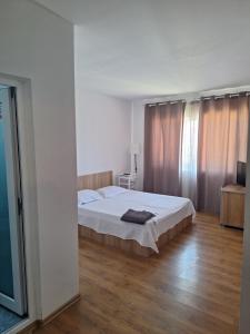 Postel nebo postele na pokoji v ubytování VILA SAMI
