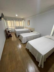 Postel nebo postele na pokoji v ubytování Harbor Buriti Hotel