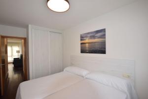 Postel nebo postele na pokoji v ubytování Apartamento Caledonia