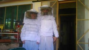 two people dressed in white costumes standing in a room at Charming Coffee Region Farm Escape in Armenia