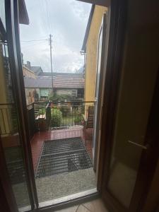 an open door with a view of a balcony at Love Stay BELLINZONA in Bellinzona +1 photo