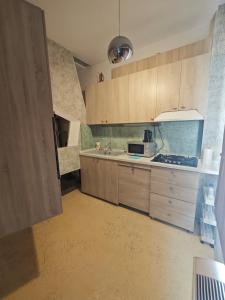 Kuchyň nebo kuchyňský kout v ubytování Luxury Apartment III