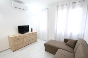 TV a/nebo společenská místnost v ubytování Appartamento Valkiria