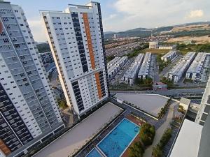an aerial view of a city with tall buildings at Alanis Suites KLIA by Cotton Cloud in Sepang