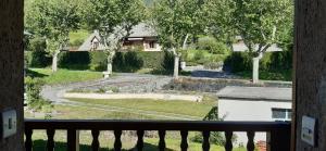 a view of a garden from a balcony at Studio Résidence Val d'Escreins in Guillestre
