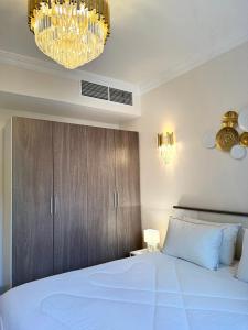 Postel nebo postele na pokoji v ubytování Salalah Hawana Marina Apartment