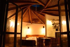 a bedroom with a bed and a table in a room at Small Round House with Living Roof in Armenia