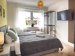 En eller flere senge i et værelse på ImmoStay D# City Apartment - Modern & WiFi