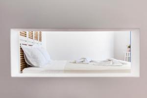 Postel nebo postele na pokoji v ubytování Aegeo Hotel