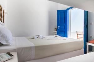 Postel nebo postele na pokoji v ubytování Aegeo Hotel