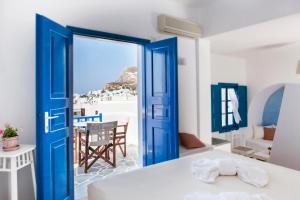 Postel nebo postele na pokoji v ubytování Aegeo Hotel