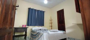 Ένα ή περισσότερα κρεβάτια σε δωμάτιο στο Arraial Hospedagens +10 φωτογραφίες